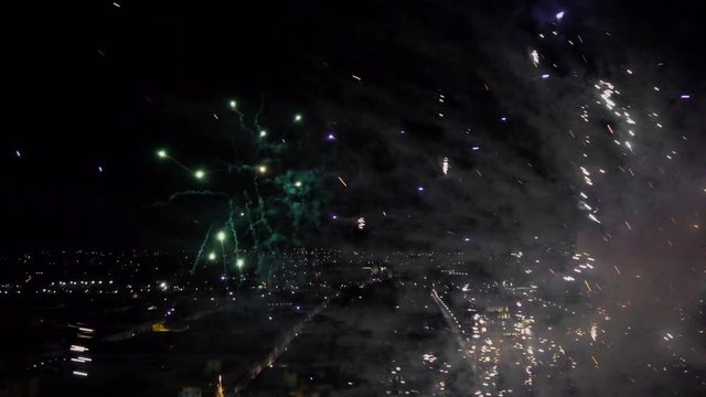 Fireworks exploding nearby with drone on party night in the city