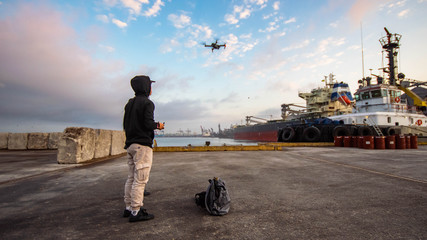 Undistracted dron pilot observes majestic seaport