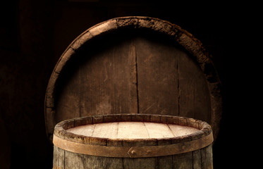 Wooden barrel on a table and textured background