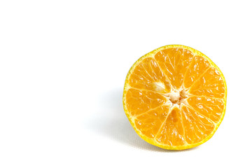 On a white background there is half a tangerine by taking a close-up shot.