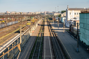 Locomotives at the railway station against the background of the city.