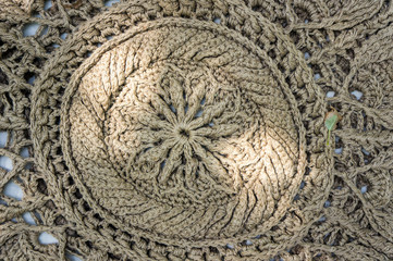 A rug made of coarse wool rope