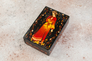 Old wooden box on concrete background.