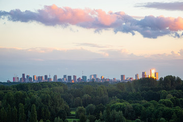 View of the skyline of Rotterdam under colorful clouds