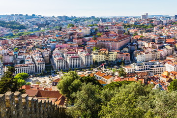 Fototapeta na wymiar Alfama and Baixa, the oldest districts of Lisbon, it spreads down the southern slope from the Castle of San Jorge to the River Tagus. Portugal