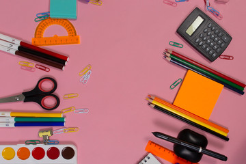 School supplies on a pink Board. Back to school.