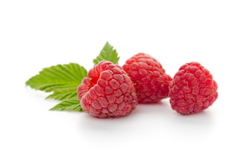  raspberries with leaf isolated on a white background