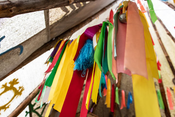 wigwam decorated with multi-colored ribbons and tassels inside
