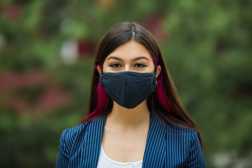 beautiful young woman in face mask