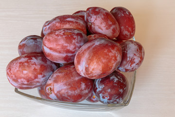 Ripe delicious juicy plums closeup.