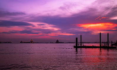 Fototapeta na wymiar Sunset over the Singapore Strait in Sentosa island