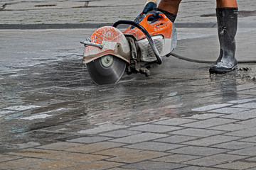  power cutter in action on a construction site in the city