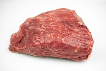 large piece of beef tenderloin, raw meat, isolated on white