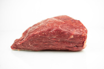 large piece of beef tenderloin, raw meat, isolated on white