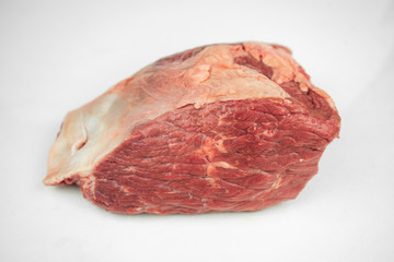 large piece of beef tenderloin, raw meat, isolated on white