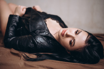 beautiful brunette in black leather jacket