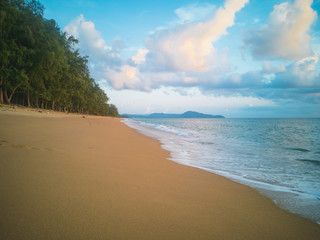 tropical beach with blue sky and clouds