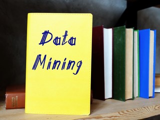 Business concept about Data mining with sign on the piece of paper.