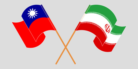 Crossed and waving flags of Iran and Taiwan