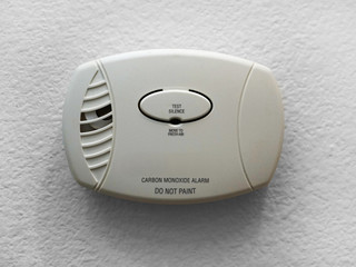 Wall mounted Carbon Monoxide Alarm installed in home.