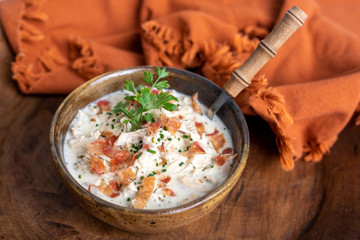 Shredded chicken in cream cheese sauce and bacon cooked in slow cooker