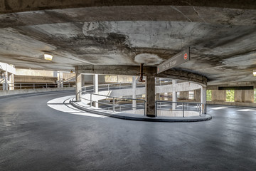 A spiral ramp in a concrete parking garage.