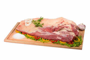 fresh and raw beef meat on cutting board on white background