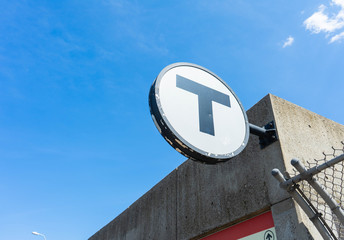 Boston MBTA sign for the Red Line T stop at UMASS Boston. 