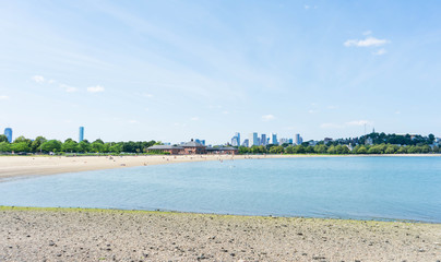 Boston skyline from the harbor point showing the beach landscape near Old Harbor and Pleasure Bay.