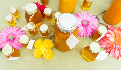 Fresh natural honey for sale from Massachusetts at the Sowa market. Floral arrangement - obrazy, fototapety, plakaty