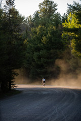 Sunset dust kicking up while riding bike
