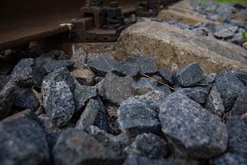 Railway rails and rubble stones.