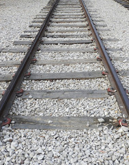 Old railway tracks leading to vanishing point