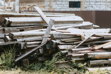 Fototapeta na wymiar recycling of lumber construction of houses wood board industry plank