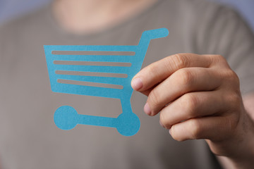 Shopping cart on digital background buying.