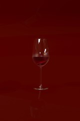 glass with red wine on a red background