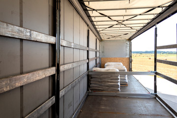 Fototapeta premium Loading into a tilt trailer of a truck
