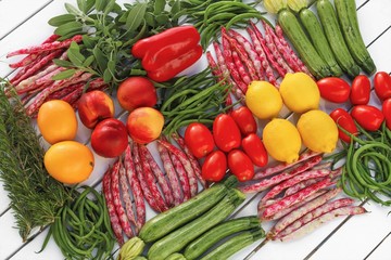 geometric composition of fruits and vegetables top view with white table background