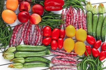 geometric composition of fruits and vegetables top view with white table background