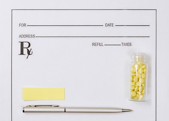 Medical concept. Yellow pills with pills, notepad, medical prescription on the doctor's desktop. Treating a patient in a hospital with medication.