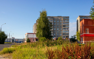 Fototapeta premium Modern town houses of brick and glass on urban street