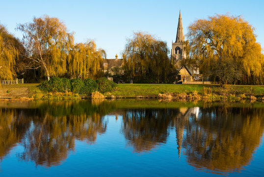 St. Mary the Virgin Church reflected in the lower pool off Great Ouse river, Godmanchester, Cambridgeshire, England, UK