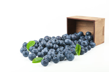 blueberry berries with green leaves on white background top view with copy space