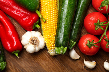 Fresh organic vegetables on wooden background. healthy eating concept. food background.