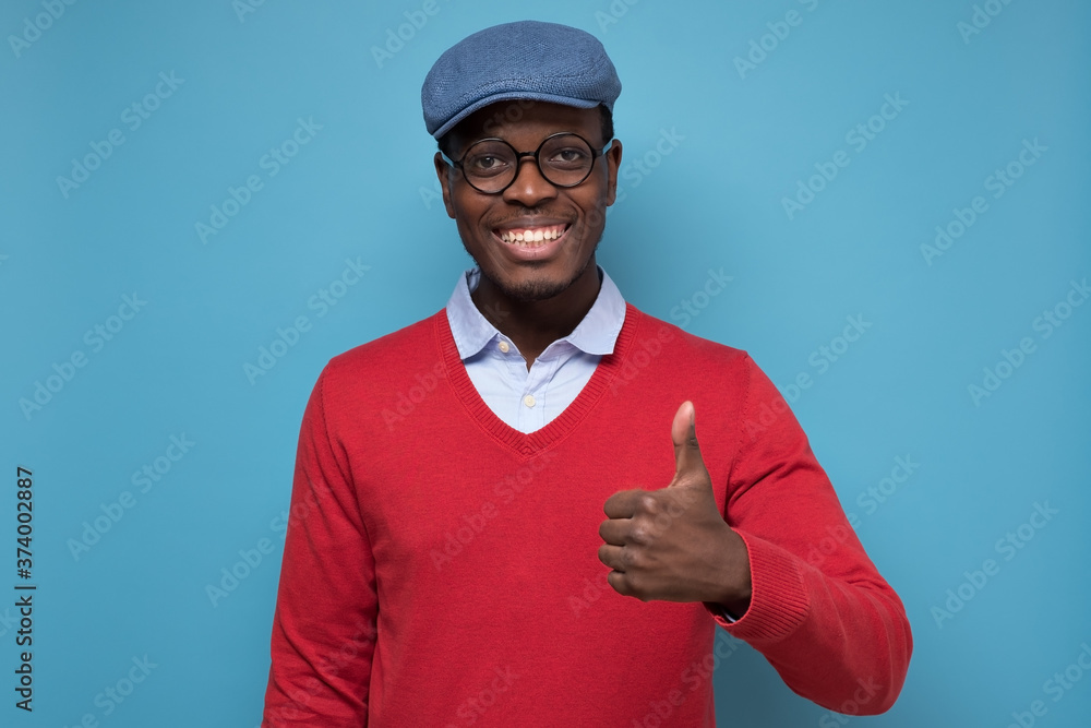 Canvas Prints african man with cheerful facial emotion showing thumb up