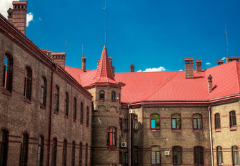 Obraz premium medieval palace residence architecture exterior facade building shingle roof and tower landmark Eastern European object colorful photo