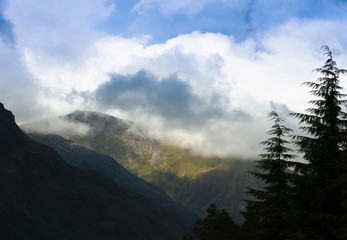 Mountains seen through low cloud at Glencoe, Scotland. UK.