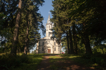 Fototapeta na wymiar Old Lutheran village church in the forest