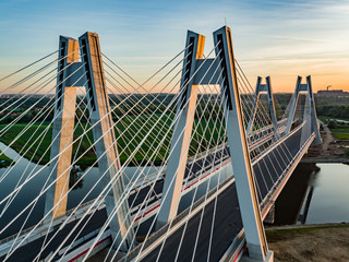 Fototapeta na wymiar most na rzece o wschodzie słońca
