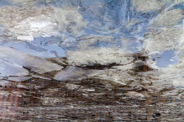 Vintage apartment house reflected in freezing Fontanka river